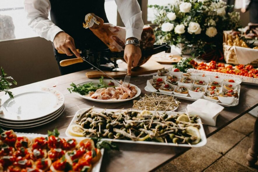 Krishnai Catering service staff plating a dish